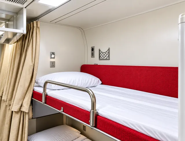 Accommodation bedroom with bedside storage