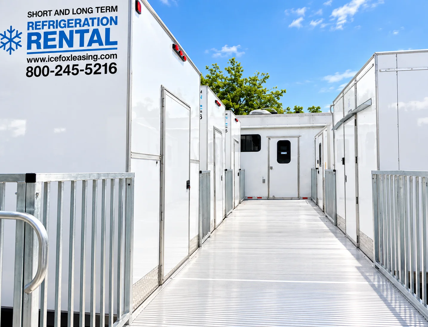 Refrigerated trailer fleet parked alongside a walkway
