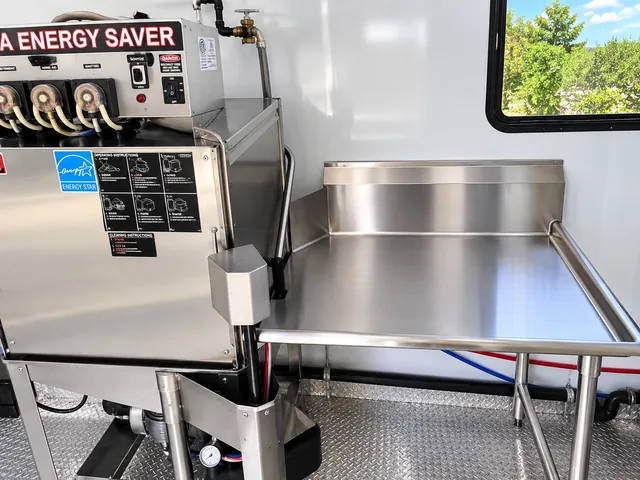 Commercial dishwasher and stainless work surface