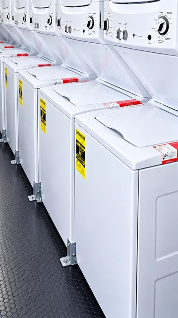 Laundry trailer row of washing machines and dryers