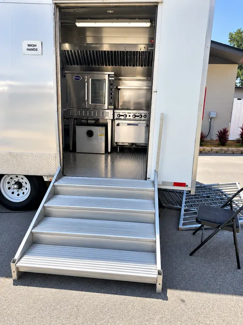 Open kitchen trailer entry with portable steps